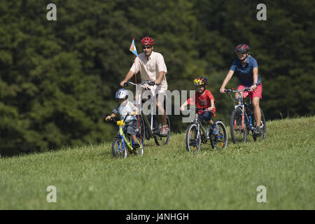 Meadow, family, cycling tour, model released, Stock Photo