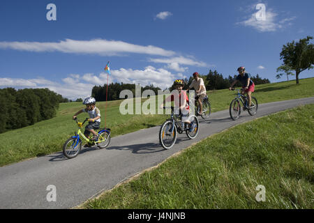 Country road, family, cycling tour, model released, Stock Photo