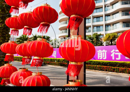 Hainan island in Shenzhou Peninsula, China - February 12, 2017: Street view at sunset with many Chinese red lanterns Stock Photo