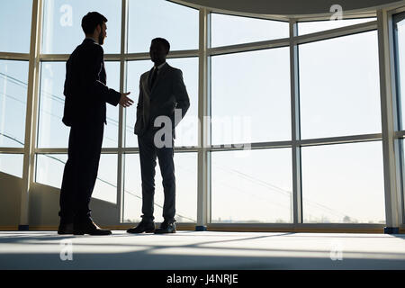 Young entrepreneurs discussing business ideas in office Stock Photo