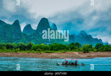 Karst mountains and Li River scenery in the mist Stock Photo