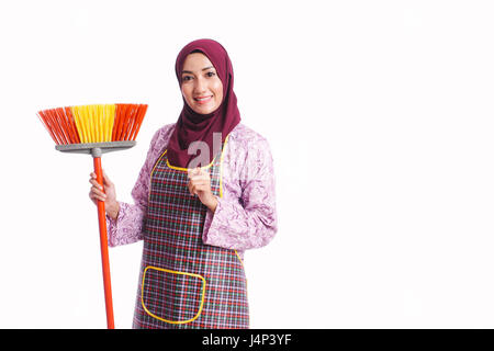 Beautiful housewife wear an apron hold cleaning equipment isolated on white background - cleaning, home and service concept Stock Photo