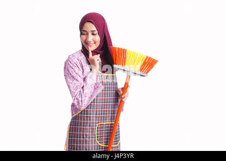 Beautiful housewife wear an apron hold cleaning equipment isolated on white background - cleaning, home and service concept Stock Photo