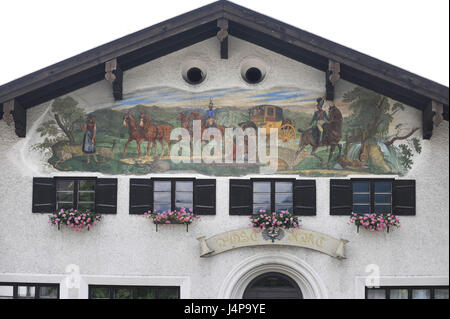 Lüftlmalerei stagecoach on a house facade in Rottach-Egern in the Tegernsee, Stock Photo