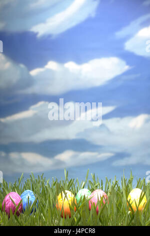 Tinted eggs, meadow, sky, clouds, Stock Photo