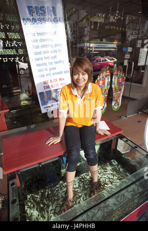 Thailand, Bangkok, Fish massage Parlour, woman, bones, water cymbals, fish, Stock Photo