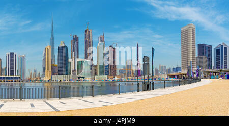 DUBAI, UAE - MARCH 29, 2017: The skyline over the new Canal and Downtown and  the promenade.