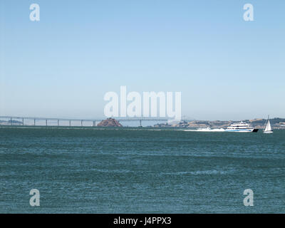 San Francisco, USA - June 10, 2011: View of long bridge to Oakland and ships on bay Stock Photo