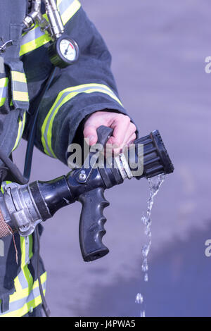 Water extingisher in hands, close up view. Stock Photo
