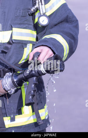 Water extingisher in hands, close up view. Stock Photo