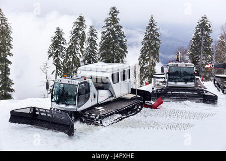 RUSSIA, SOCHI, GORKY GOROD - MARCH 26, 2017: Snowcat machines on slopes of Gorky Gorod ski resort are ready for night work Stock Photo