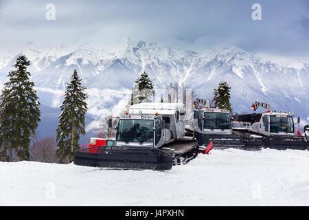 RUSSIA, SOCHI, GORKY GOROD - MARCH 26, 2017: Snowcat machines on slopes of Gorky Gorod ski resort are ready for night work Stock Photo