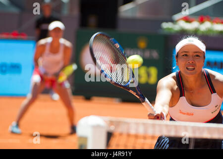 Madrid, Spain. 13th May, 2017. Chan Yung-Jan (R) of Chinese Taipei and Martina Hingis of Switzerland compete during the women's doubles final match of the Mutua Madrid Open against Timea Babos of Hungary and Andrea Hlavackova of the Czech Republic in Madrid, Spain, May 13, 2017. Martina Hingis/Yung-Jan Chan won 2-0 and claimed the title. Credit: Belen Diaz/Xinhua/Alamy Live News Stock Photo