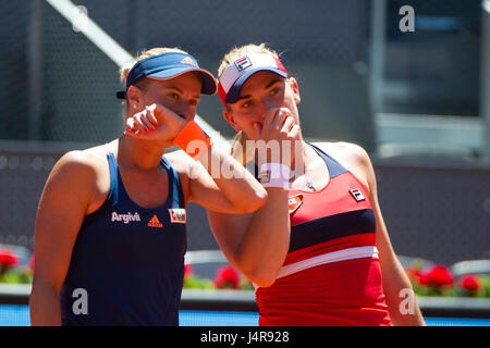 Madrid, Spain. 13th May, 2017. Timea Babos (R) of Hungary and Andrea Hlavackova of the Czech Republic talk to each other during women's doubles final match of the Mutua Madrid Open against Martina Hingis of Switzerland and Chan Yung-Jan of Chinese Taipei in Madrid, Spain, May 13, 2017. Martina Hingis/Yung-Jan Chan won 2-0 and claimed the title. Credit: Belen Diaz/Xinhua/Alamy Live News Stock Photo