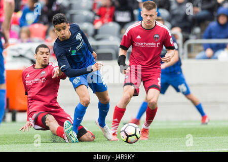 Ottawa, Canada. 13th May, 2017. Pittsburgh Riverhounds Victor Souto (5) fights for the ball with Ottawa Fury FC Onua Thomas Obasi (14) and Jonathan Barden (2) during the USL match between Pittsburgh Riverhounds and Ottawa Fury FC at TD Place in Ottawa, Canada. Daniel Lea/CSM/Alamy Live News Stock Photo