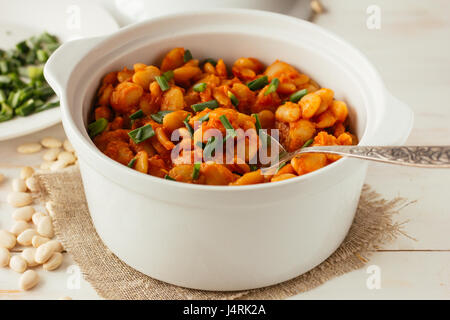 Baked lima beans in white pot selective focus Stock Photo