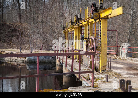 Small dam bridge on the Oredezh River. Leningrad Oblast, Russia Stock Photo