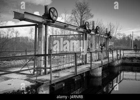 Small dam on the Oredezh River. Leningrad Oblast, Russia. Black and white photo Stock Photo