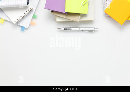 Top view  accessories business office desk.notebook pen paper note on white background with copy space. Stock Photo