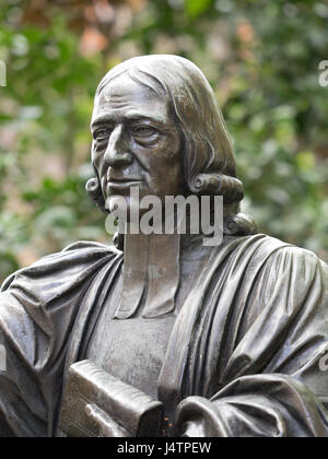 Statue of John Wesley, cleric and co-founder of Methodism, in St Paul's Cathedral Churchyard, London. cast from a sculpture created by Samuel Manning. Stock Photo