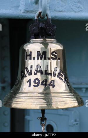 The main bell from HMS Cavalier which is a retired C-class destroyer of the Royal Navy. She was laid down by J. Samuel White and Company at East Cowes on 28 March 1943, launched on 7 April 1944,[1] and commissioned on 22 November 1944.[3] She served in World War II and in various commissions in the Far East until she was decommissioned in 1972. After decommissioning she was preserved as a museum ship and currently resides at Chatham Historic Dockyard. Stock Photo