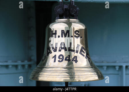 The main bell from HMS Cavalier which is a retired C-class destroyer of the Royal Navy. She was laid down by J. Samuel White and Company at East Cowes on 28 March 1943, launched on 7 April 1944,[1] and commissioned on 22 November 1944.[3] She served in World War II and in various commissions in the Far East until she was decommissioned in 1972. After decommissioning she was preserved as a museum ship and currently resides at Chatham Historic Dockyard. Stock Photo