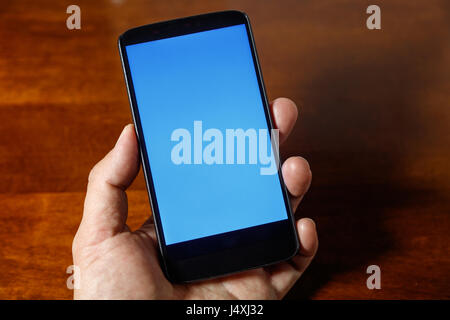 showing smartphone with blank screen. business communication concept. Stock Photo