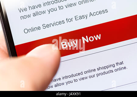 smartphone touch screen with red button. business e-commerce concept. Stock Photo