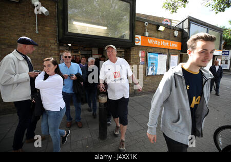 Fans arrive at White Hart lane underground station prior to the Premier League match at White Hart Lane, London. Stock Photo