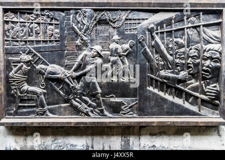 Plaque showing conditions and abuses during French Colonial times at Hoa Lo prison Hanoi Vietnam. During Vietnam war held American POWs Stock Photo