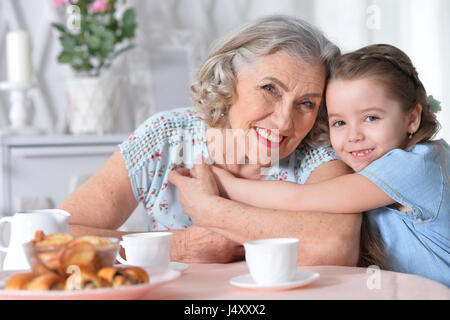 grandmother with a small granddaughter drinking tea Stock Photo
