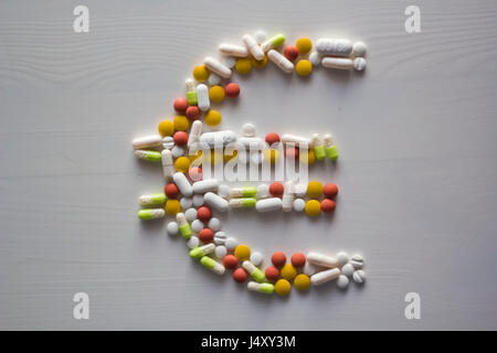 Pills in shape of Euro money sign symbol Stock Photo