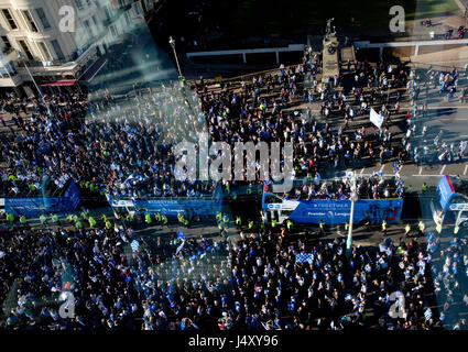 Brighton and Hove Albion football fans cheer their team during the bus parade through Brighton. Stock Photo