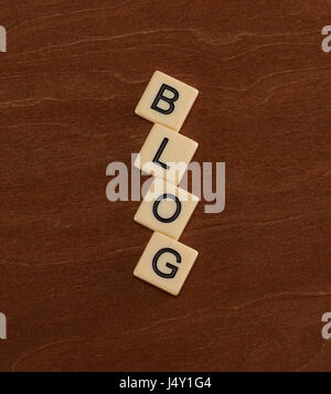 Personal Blog Headline. Social networking concept. Ivory tiles with capital letters on mahogany board. Stock Photo
