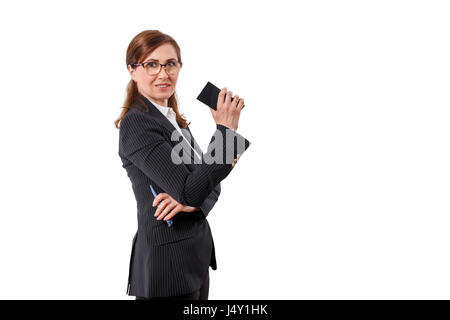Portrait of a beautiful businesswoman 50 ears old with mobile phone isolated on white. Stock Photo