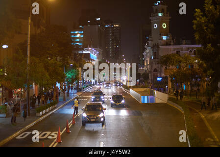 Lima, Peru - April 23, 2017: Car traffic in Lima city at night in Miraflores district Stock Photo