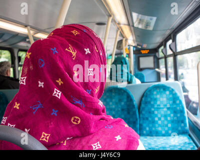 Two ladies wearing Hijabs on a London bus Stock Photo