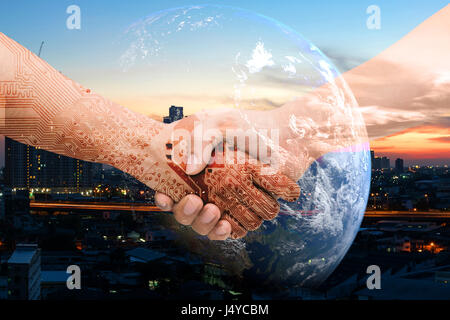Industry 4.0 internet of things and digital disruption concept. Double exposure of Shaking hands of male people and robot circuit electronic hand with Stock Photo