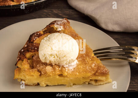 Slice of apple pie with icecream cone on blurred background Stock Photo