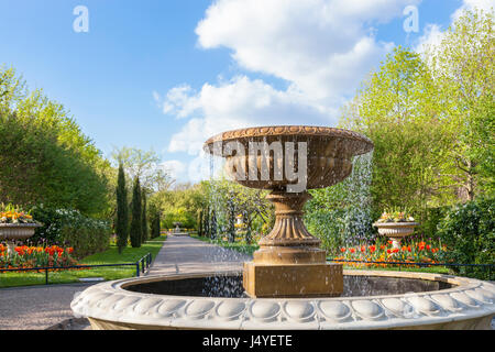 Trees, flowers and fountain in Avenue Gardens at Regents Park, London, one of the Royal Parks. London, England, UK Stock Photo