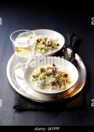 Cheese soup with german minced pork meat and pretzel croutons Stock Photo