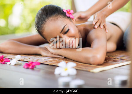 professional masseur doing massage of female back in the beauty salon Stock Photo