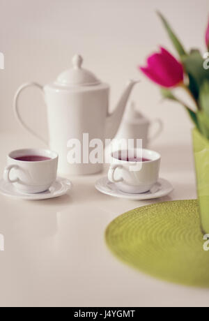 https://l450v.alamy.com/450v/j4ygmt/beautiful-white-porcelain-tea-service-on-table-j4ygmt.jpg