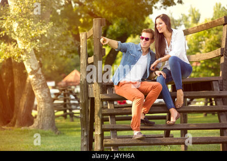 Modern fashion couple of young lovers in the park Stock Photo