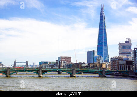 LONDON - APR 20 : The Shard building and riverside pictured on April 20th, 2017, in London. The Shard opened to the public on February 2013. Standing 309m, the Shard is the tallest building in Europe. Stock Photo