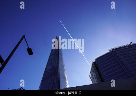 LONDON - APR 20 : The Shard building at sunset pictured on April 20th, 2017, in London. The Shard opened to the public on February 2013. Standing 309m, the Shard is the tallest building in Europe. Stock Photo