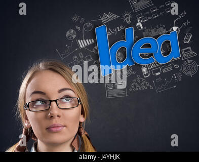 Young girl with glasses thinking Stock Photo