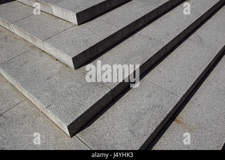 Abstract stairs , abstract steps, stairs in the city, granite stairs,wIde stone stairway often seen on monuments and landmarks,wide stone stairs, steps,black and white photo,diagonal Stock Photo