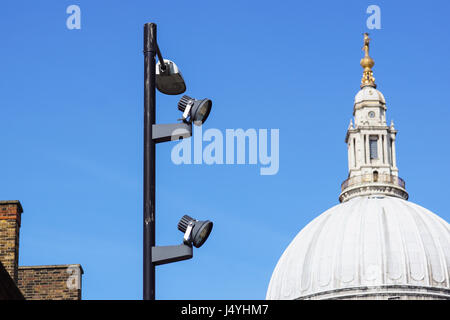 urban Pillar spotlights high on the blue sky at London city Stock Photo