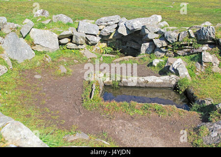 Fulacht fiadh water trough and fireplace building at Drombeg stone circle, County Cork, Ireland, Irish Republic Stock Photo